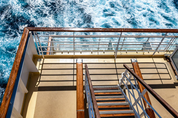 istock Cruise ship stairs to open deck railing with sea in the background 1487816473