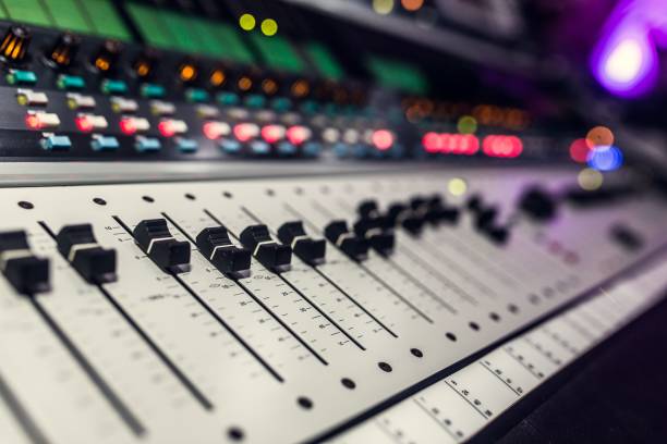 istock a sound mixer and some colorful lights on a black counter 1487818193