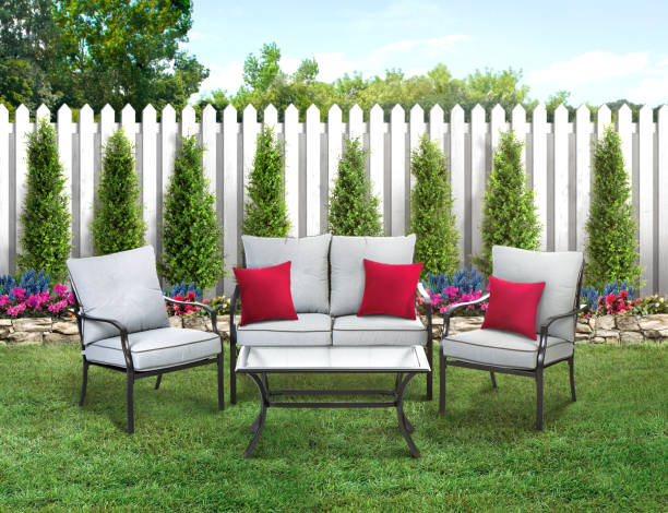 istock Patio set in a backyard with grass and wood fence 1487819265