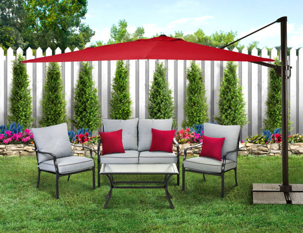istock Patio set in a backyard with grass and wood fence 1487819269