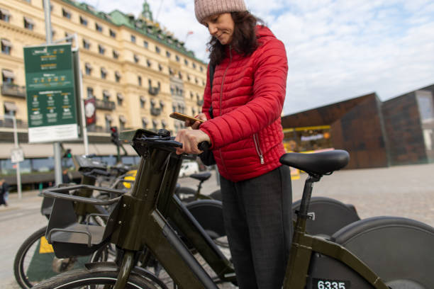 istock Mature woman renting bicycle 1487820745