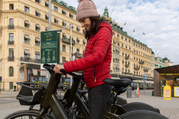 istock Mature woman renting bicycle 1487820746