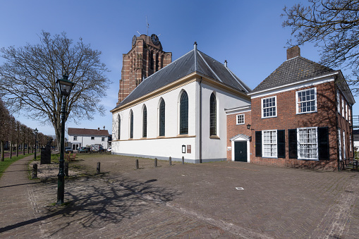 St. Pieterskerk or Petruskerk in the Dutch village of Beesd with a striking, unfinished tower built around the year 1500.