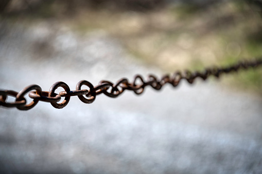 a chain of steel with very nice Bokeh. Off fokus background.