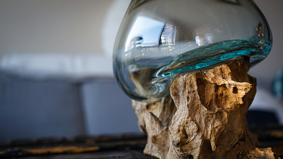 Centrepiece of glass melted over driftwood