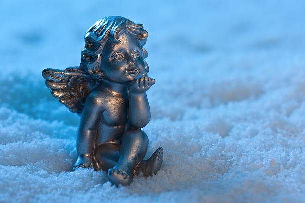 Angel in a beautiful blue snow setting