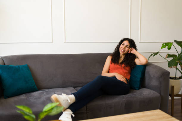 istock Beautiful woman relaxing and resting on the sofa 1487827245