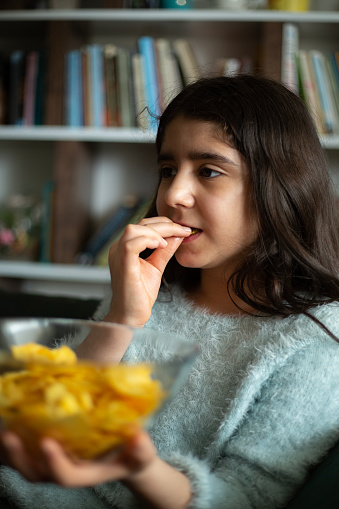 Girl Eating Potato Crisps