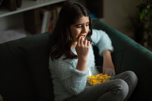 Girl Eating Potato Crisps