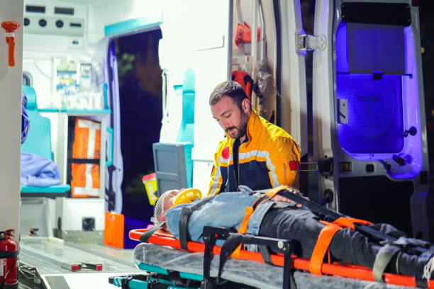 istock Health Worker Helping Patient on Stretcher, Ambulance and First Aid 1487830141