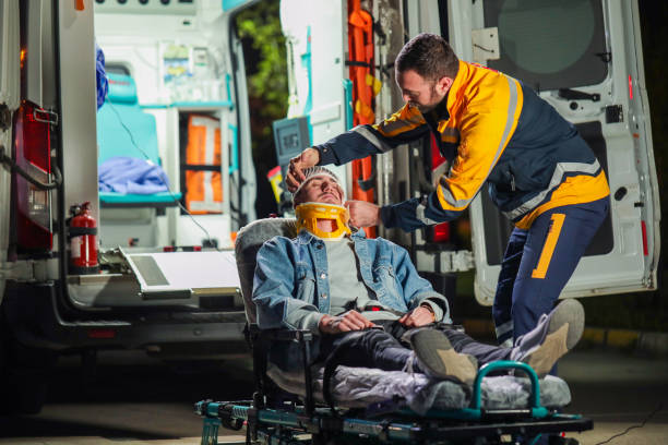 istock Health Worker Helping Patient on Stretcher, Ambulance and First Aid 1487830211