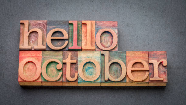 istock hello October greeting card - letterpress wood type blocks against gray slate stone 1487835410