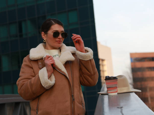 istock Modern woman on business trip wit hat and coffee 1487838046