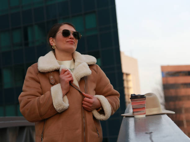 istock Modern woman on business trip wit hat and coffee 1487838057