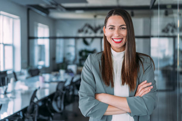 istock Confident businesswoman in modern office. 1487838141