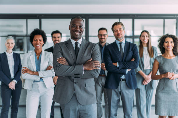 istock Confident businessman and his team. 1487838874