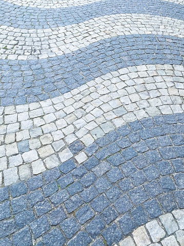 Swirl pattern of Cobblestone in Copenhagen, two stones, however,  break the pattern!