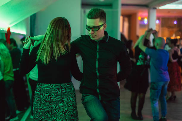 istock Couple dancing salsa at the party 1487839278