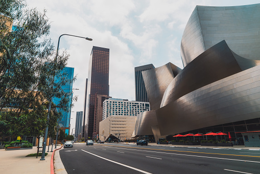 Los Angeles, California, USA - April 25, 2023.  Grand Avenue in downtown City of Los Angeles. The Wall Disney Concert Hall and The Broad, a contemporary art museum , street view