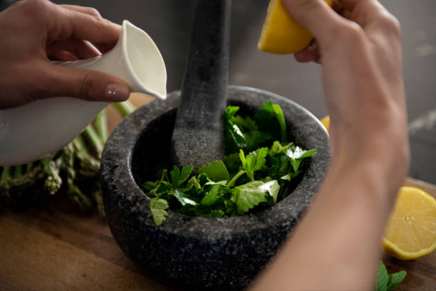 istock Mortar and pestle with herbs and lemon 1487840292