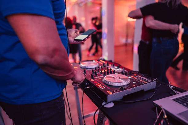 istock DJ playing music at a party indoors 1487841088