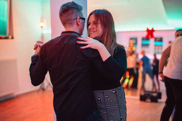 istock Couple dancing salsa at the party 1487841419