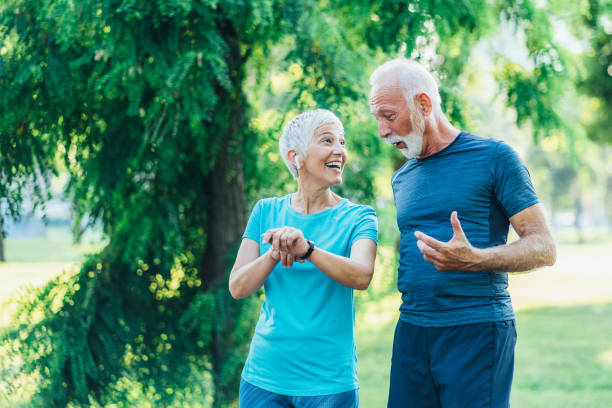 istock Senior friends jogging together 1487843858