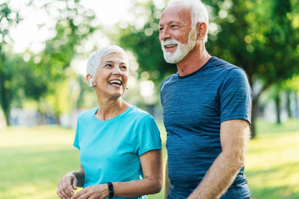 istock Senior friends jogging together 1487843868
