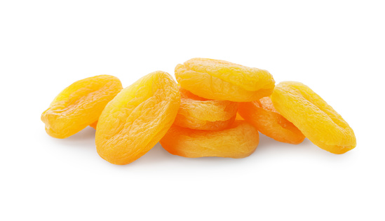 Pile of dried apricots on white background