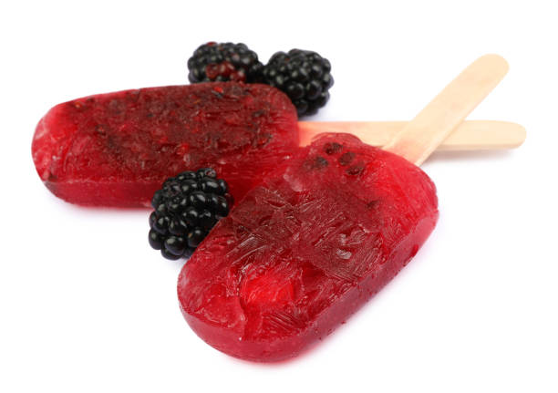 istock Delicious ice pops and fresh blackberries on white background. Fruit popsicle 1487844526