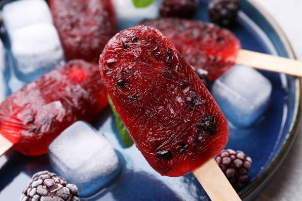 istock Tasty blackberry ice pops, closeup. Fruit popsicle 1487844574