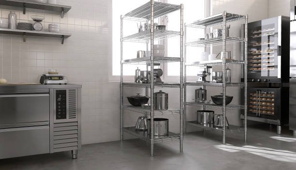 istock Stainless steel shelf with professional baking equipment, machines, kitchenware, convention oven in white tile wall commercial, professional bakery kitchen in sunlight from window 1487845794