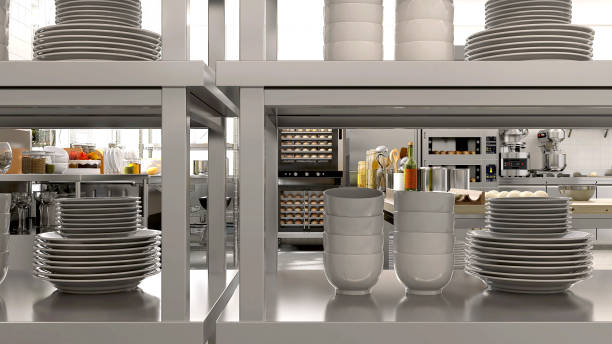 istock Close up white ceramic plate, dish, bowl stack on stainless steel shelf in professional, industrial bakery kitchen with convection, bread bun in deck oven, equipment, machine in sunlight 1487845806