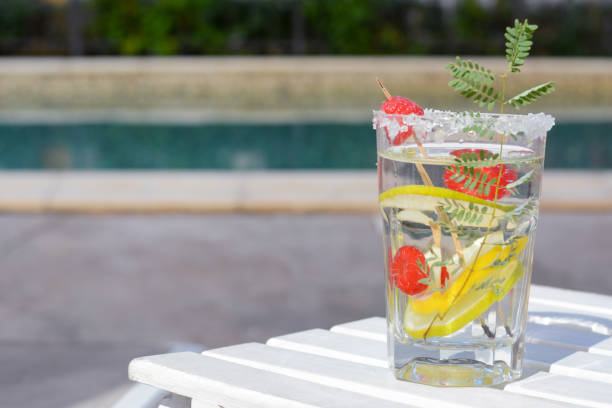 istock Delicious refreshing lemonade with raspberries on white wooden table outdoors, space for text 1487849027