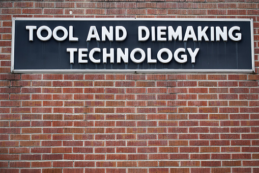 Close up of took and diemaking technology sign
