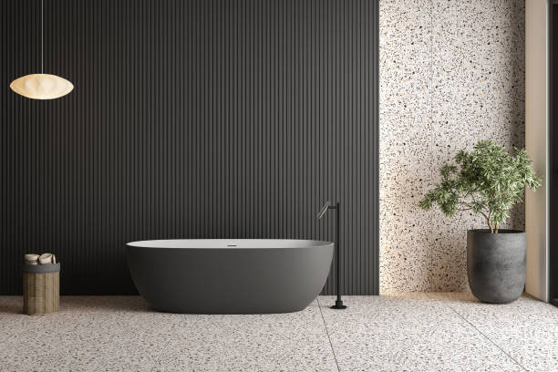 istock Modern bathroom featuring a sleek white vanity, terrazzo flooring, a black wall panel, a basket, a pendant lamp, and natural light pouring in through the window. 3d rendering 1487849862