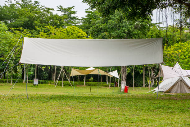 istock Camping tents on green grass in the park 1487850160