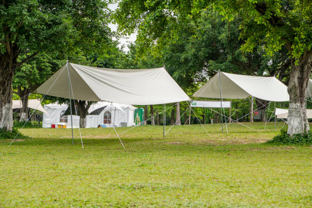 istock Camping tents on green grass in the park 1487850284