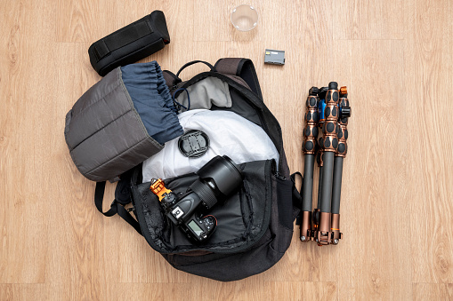 Photography set with backpack, digital camera, carbon tripod, extra battery, diffuser and cobra flash