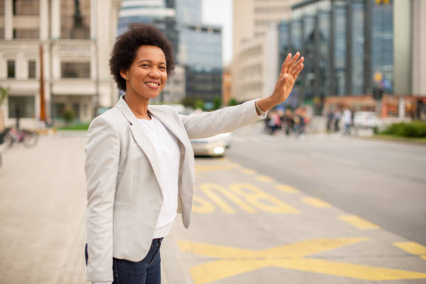 istock African American woman calling a cab 1487857514