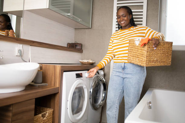 istock Young woman doing her laundry at home 1487858691