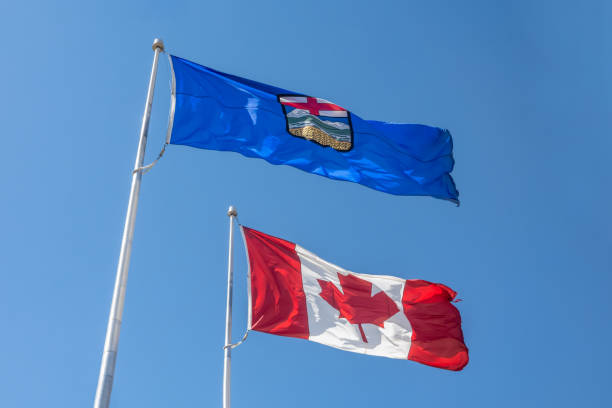 istock An Alberta flag on top of a Canada flag waving. 1487859710