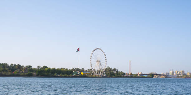 istock Sharjah cityscape with UAE flag. 1487859885