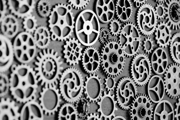 istock Black and white background with metal gears. 1487866619