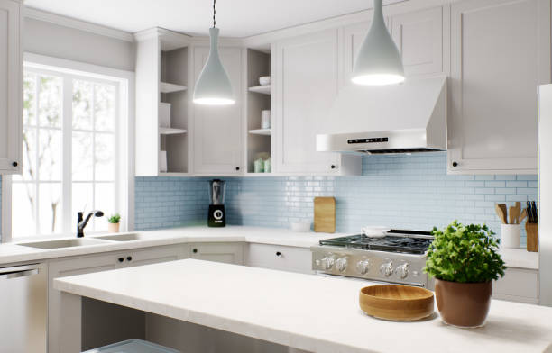 istock Spacious bright kitchen with a blue apron and blue chairs. 3d rendering. Focus on the marble countertop against the backdrop of kitchen appliances and utensils. 1487867692