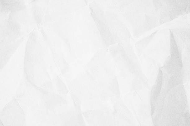 istock Crumpled white paper texture background for various purposes. 1487875298