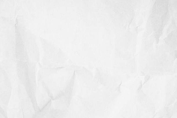 istock Crumpled white paper texture background for various purposes. 1487875299