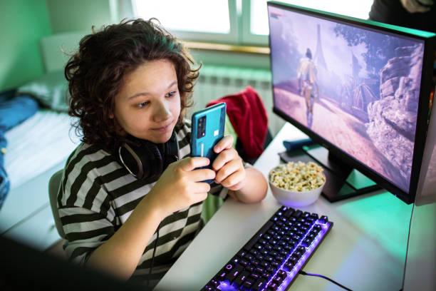 Playing Using Phone 7,800+ Children Playing Smartphone Gadget Addiction Stock Photos ...