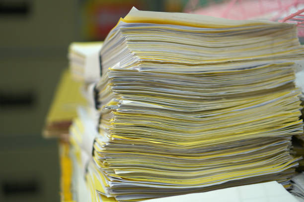 istock Paper stack on the desk related to business functions. With morning light,soft focus 1487882587