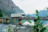Truck on the bridge across the river  in Norway